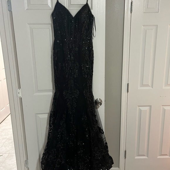 It’s a black beaded dress flare at the bottom open in the back - Picture 2 of 3